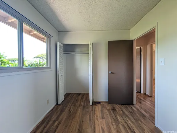 a view of hallway with wooden floor