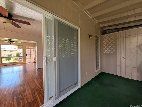 a view of gallery with wooden floor