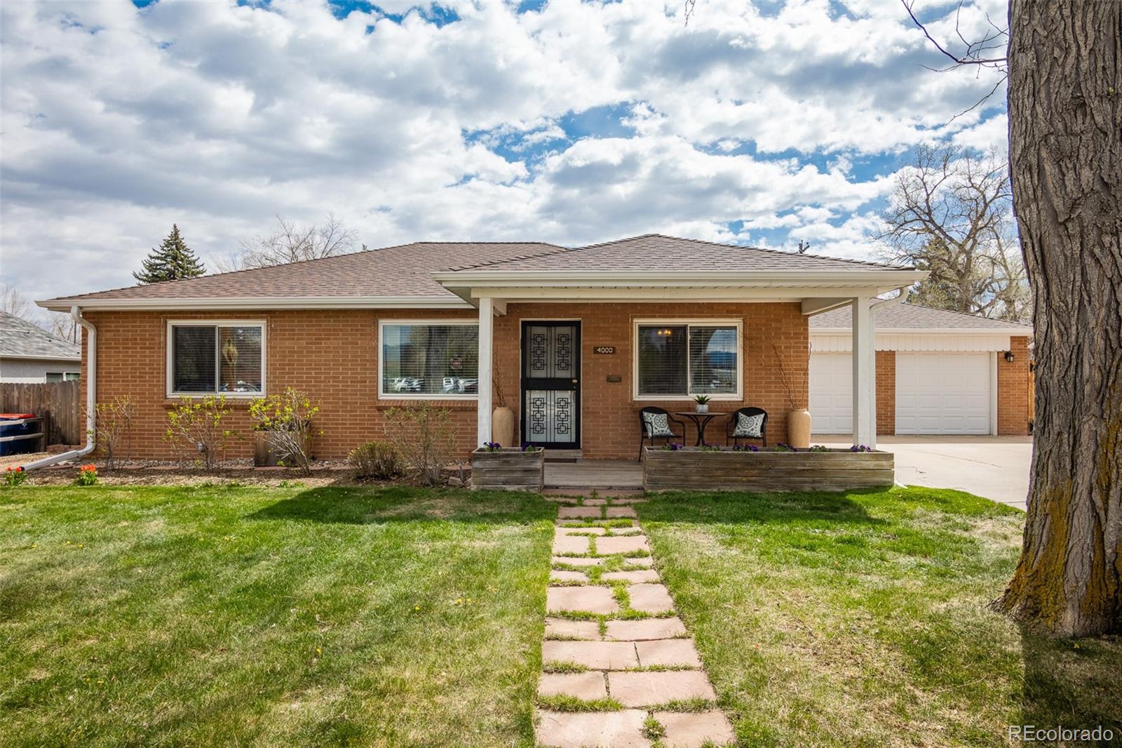 4000 Reed Street Wheat Ridge, CO 80033 - Photo 1 of 44 a view of a house with a backyard