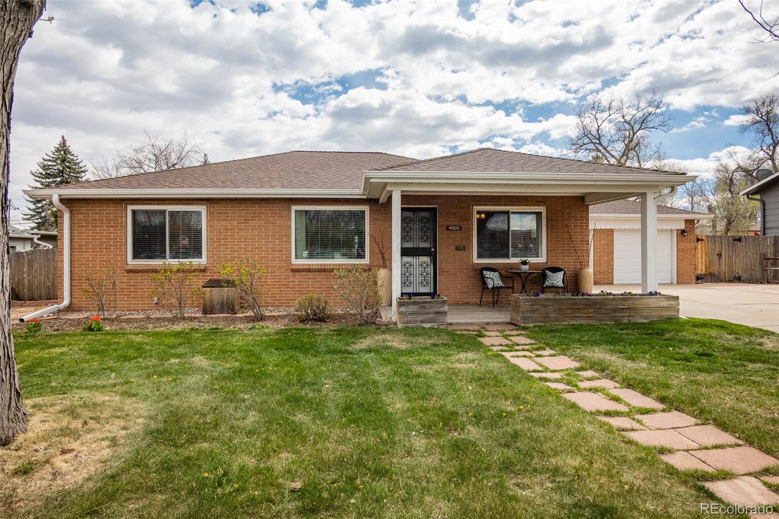 4000 Reed Street Wheat Ridge, CO 80033 - Photo 2 of 44 a view of a house with a patio