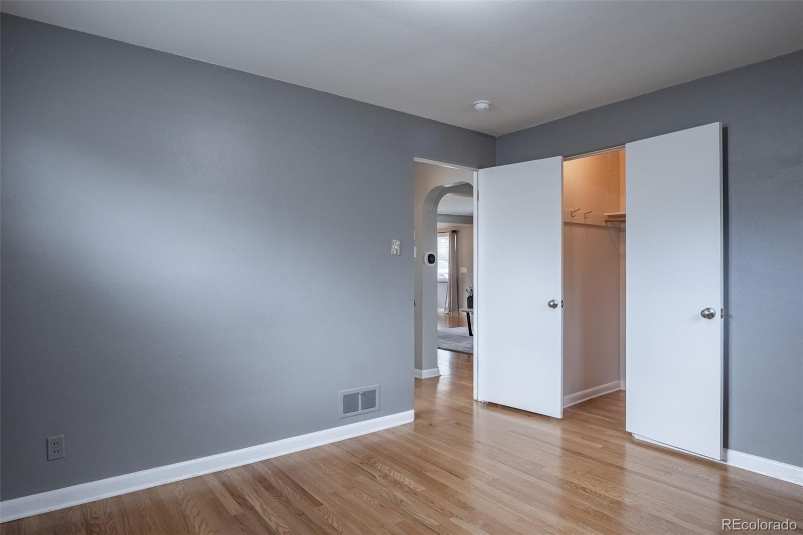 4000 Reed Street Wheat Ridge, CO 80033 - Photo 23 of 44 a view of an empty room with wooden floor and a window