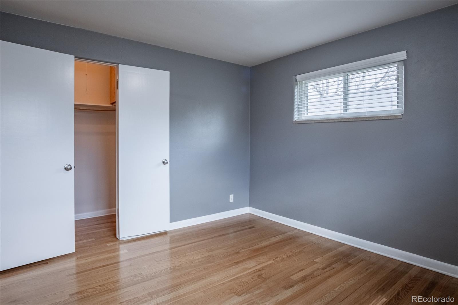 4000 Reed Street Wheat Ridge, CO 80033 - Photo 24 of 44 an empty room with wooden floor and windows