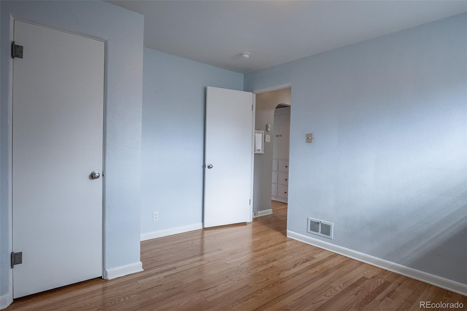 4000 Reed Street Wheat Ridge, CO 80033 - Photo 26 of 44 a view of an empty room with wooden floor