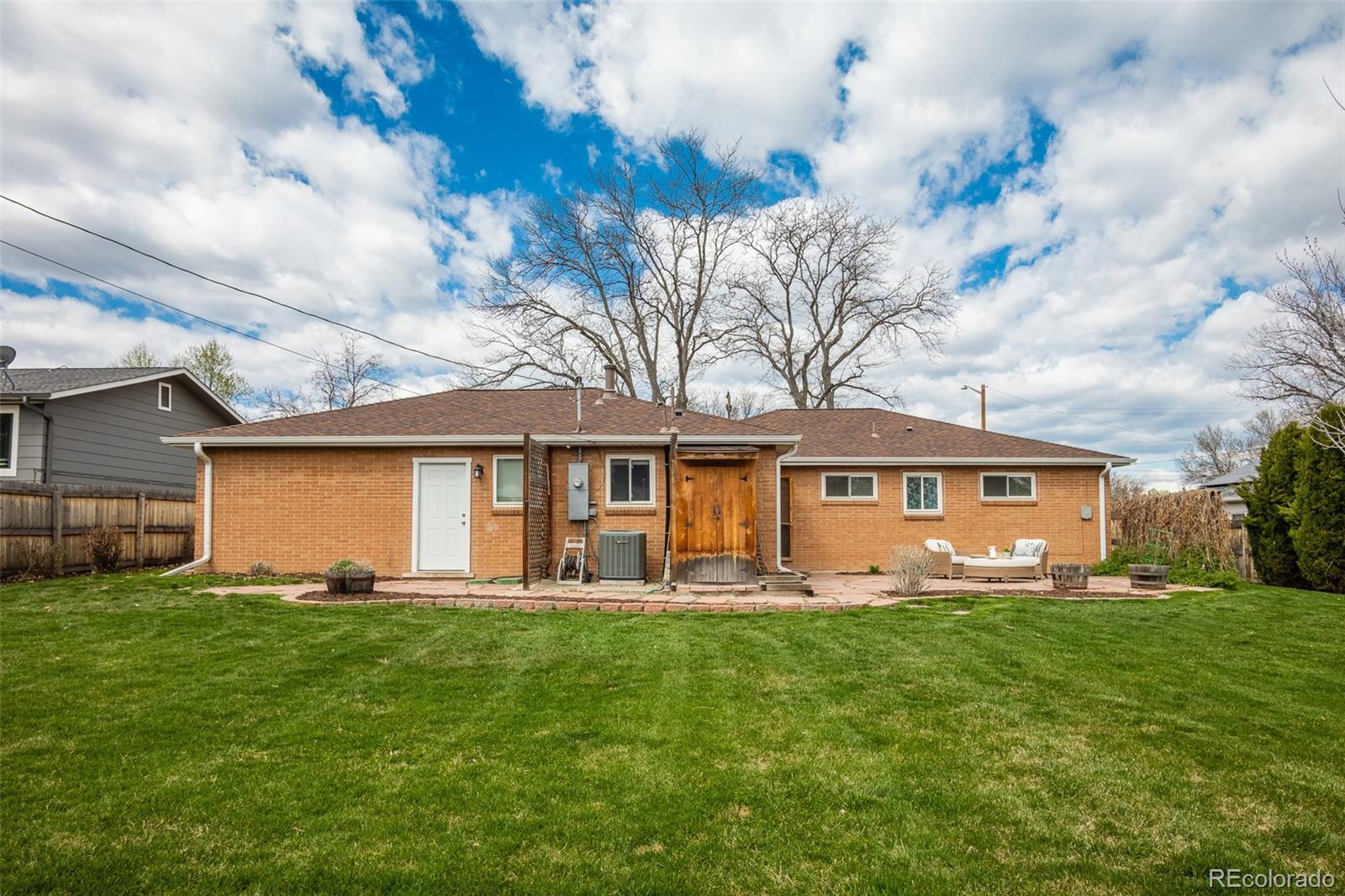 4000 Reed Street Wheat Ridge, CO 80033 - Photo 40 of 44 a front view of a house with a yard