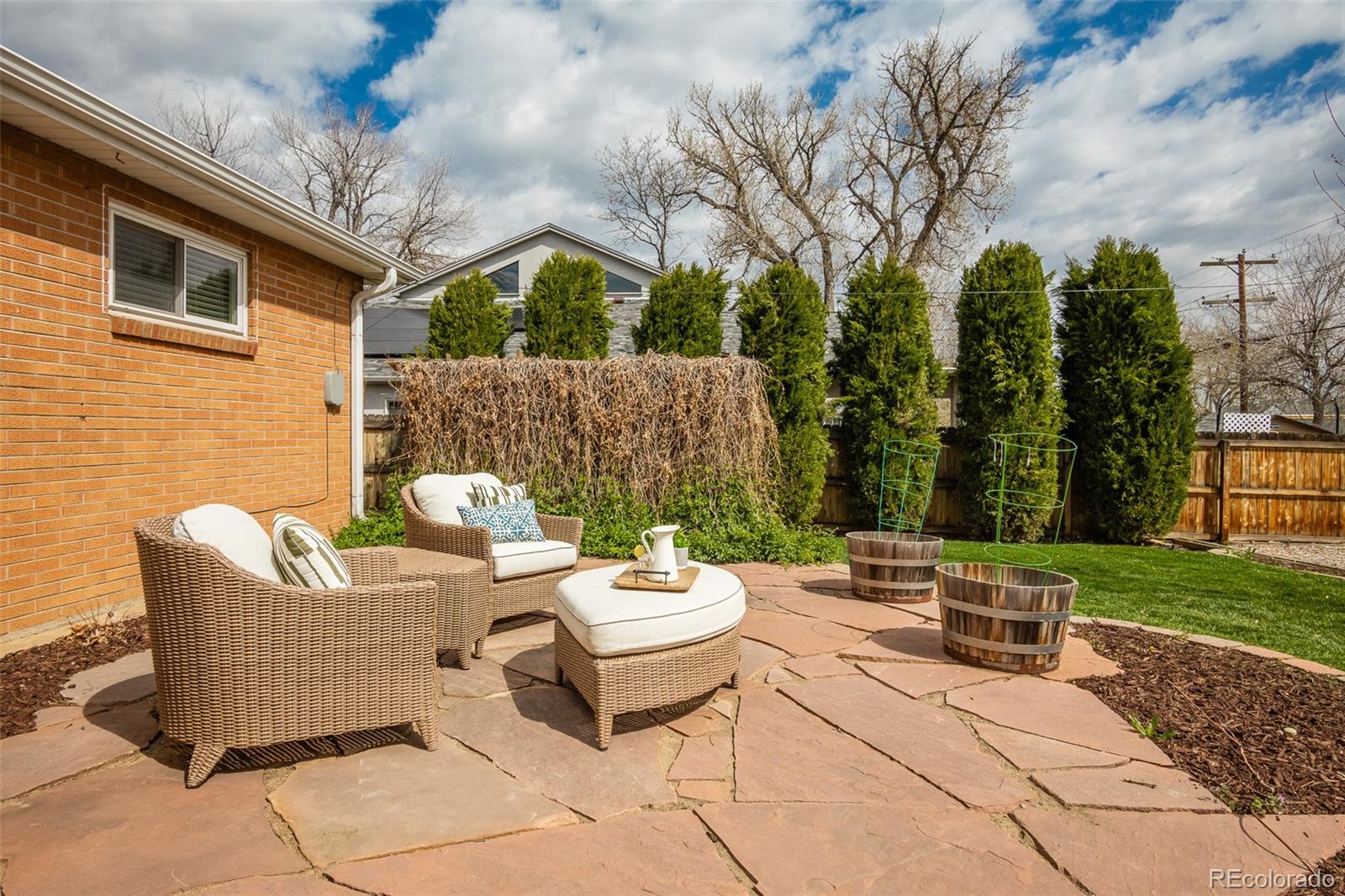 4000 Reed Street Wheat Ridge, CO 80033 - Photo 43 of 44 a view of a patio with a table and chairs and couches