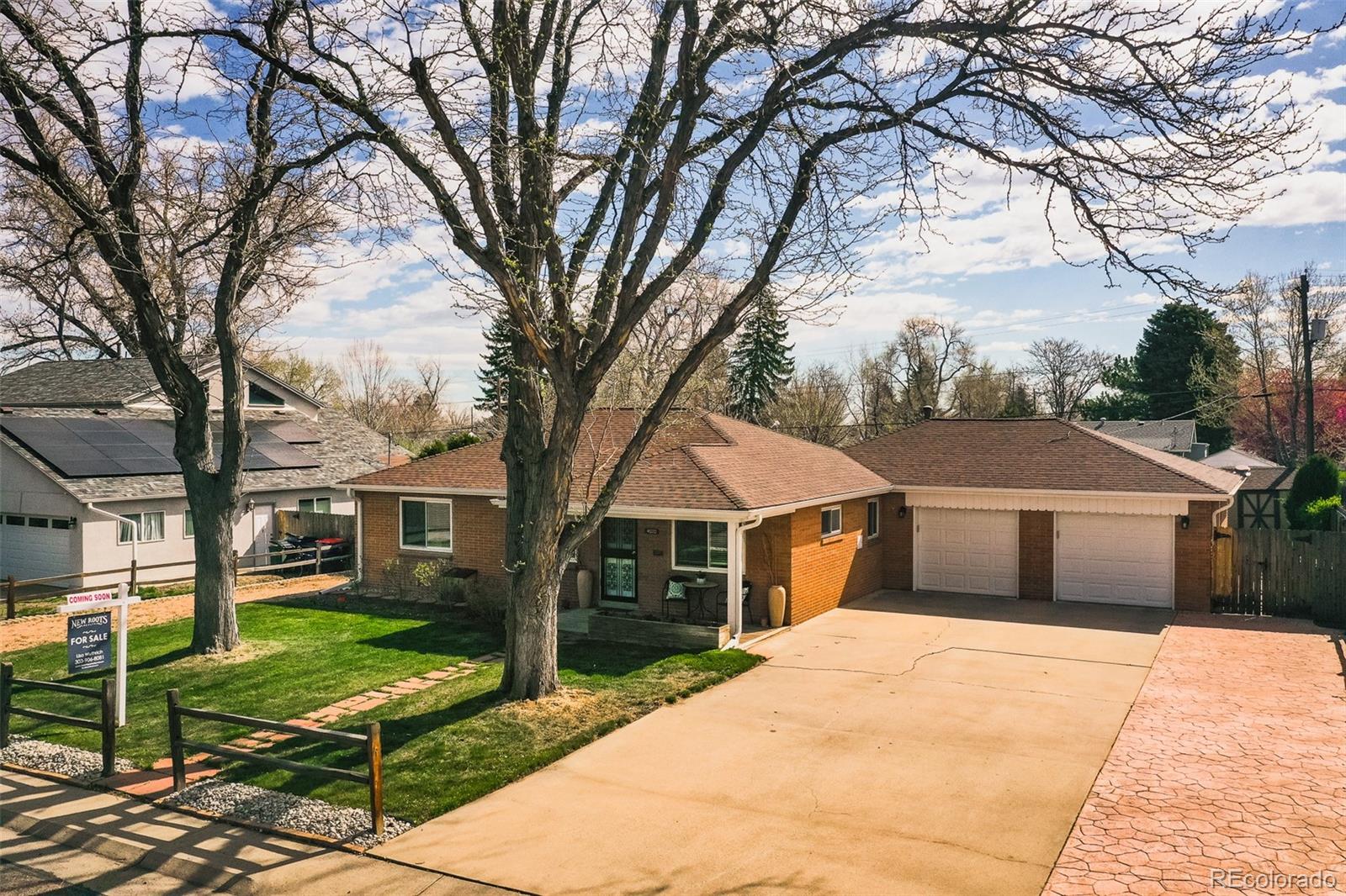 4000 Reed Street Wheat Ridge, CO 80033 - Photo 6 of 44 a front view of a house with garden