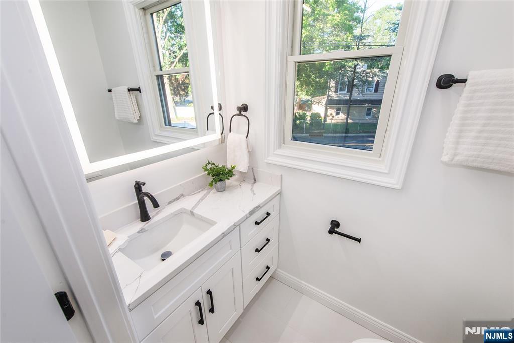145 Grove Street Mahwah, NJ 07430 - Photo 13 of 30 a bathroom with a sink and a window