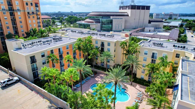 an aerial view of multiple houses with yard