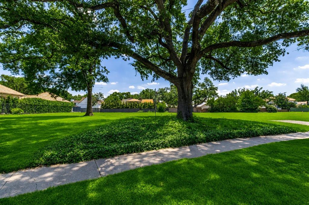 4311 Rheims Place Highland Park, TX 75205 - Photo 3 of 9 Spacious lawn featuring mature trees providing ample shade
