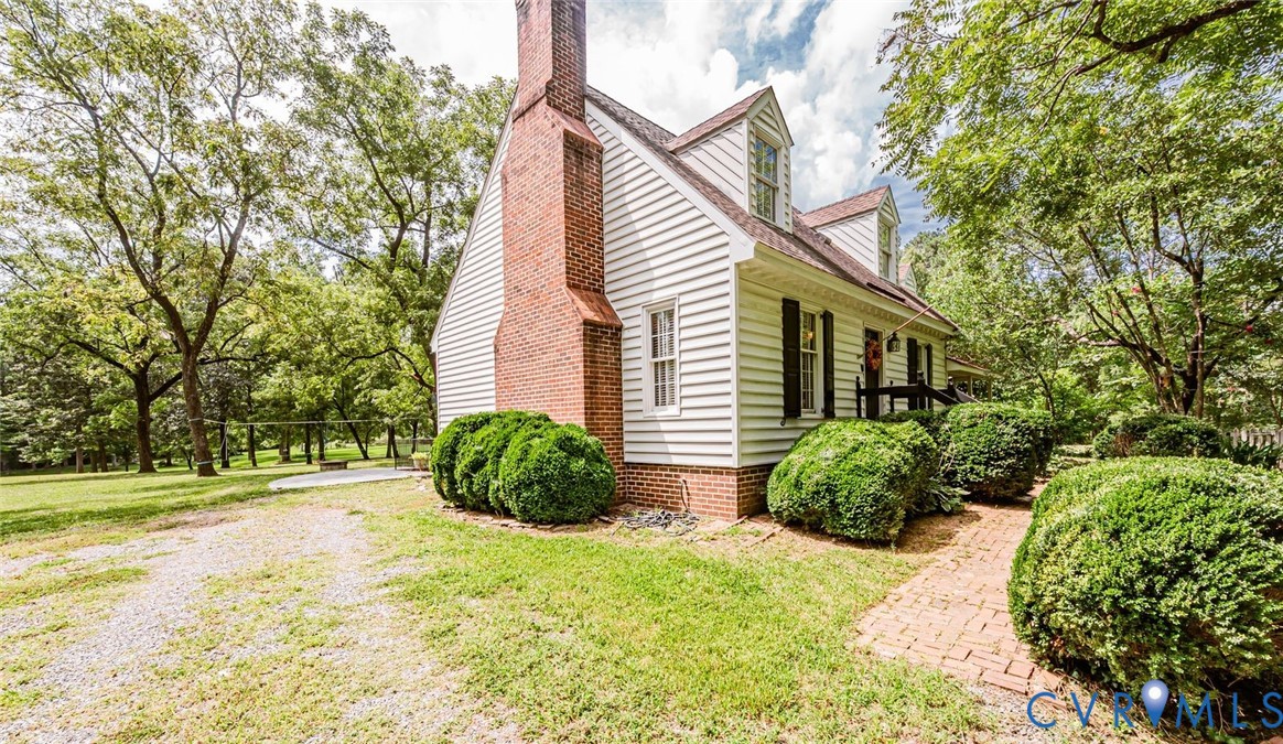 7300 Old Roxbury Road Quinton, VA 23141 - Photo 10 of 89 White siding exterior with brick foundation, side-