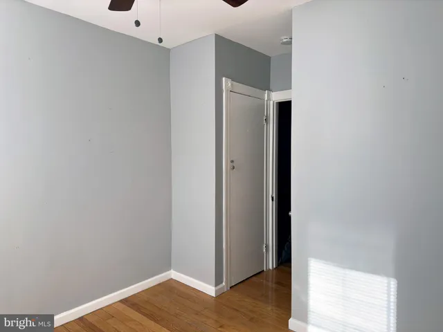 a kitchen with granite countertop a refrigerator sink and cabinets