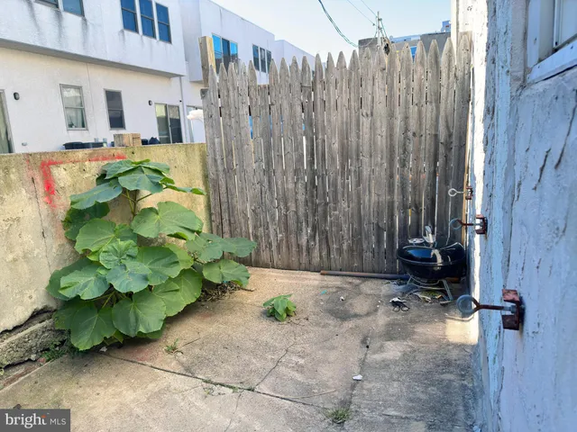 a view of a car parked in front of a house