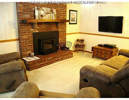 3 Barrington Road Nitro, WV 25143 - Photo 12 of 16 Den/Family/Great Room. Lower level family room with wood burning stove in fireplace