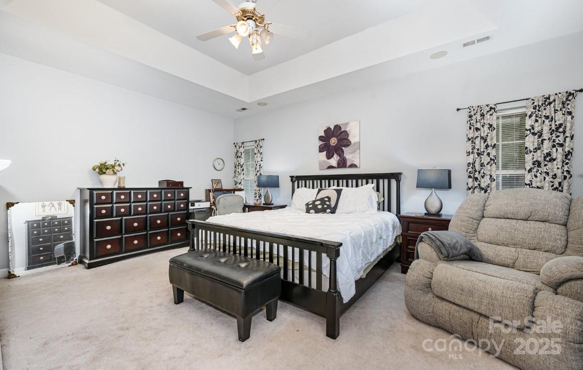 6930 Reedy Creek Road Charlotte, NC 28215 - Photo 13 of 28 a bedroom with furniture and a couch