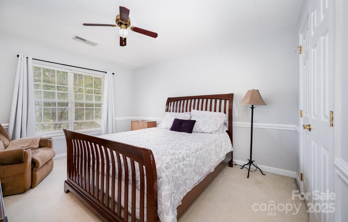 6930 Reedy Creek Road Charlotte, NC 28215 - Photo 18 of 28 a bedroom with bed and a window