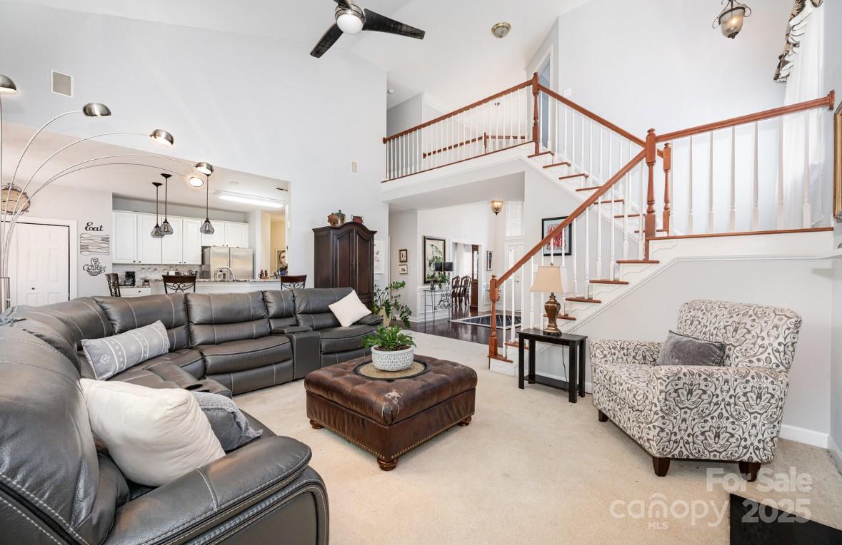 6930 Reedy Creek Road Charlotte, NC 28215 - Photo 3 of 28 a living room with furniture and a chandelier
