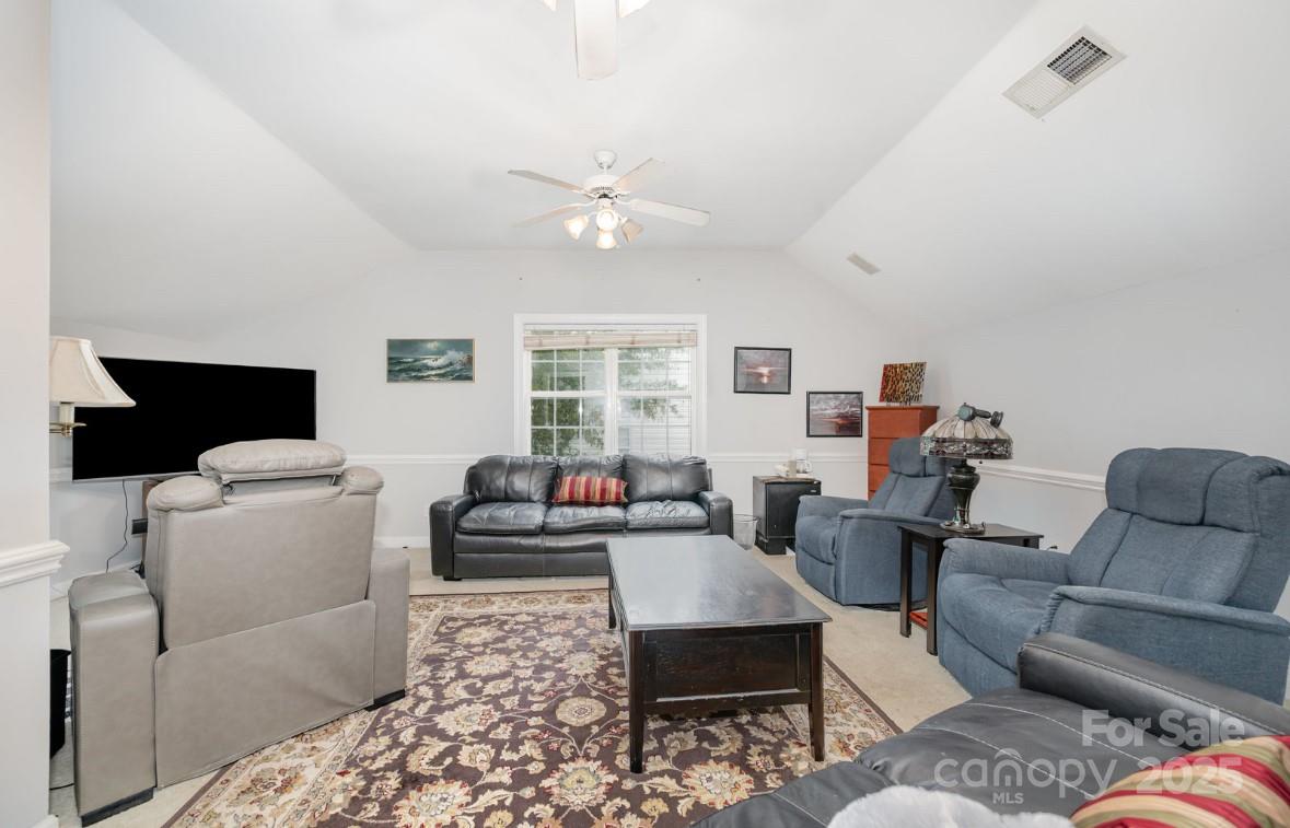 6930 Reedy Creek Road Charlotte, NC 28215 - Photo 9 of 28 a living room with furniture and a window