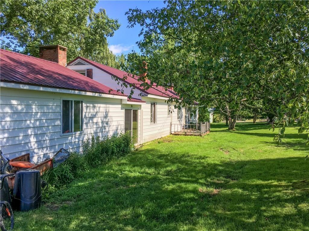 526 Enfield Road Lincoln, ME 04457 - Photo 4 of 31 Back of home, deck & sliding glass...
