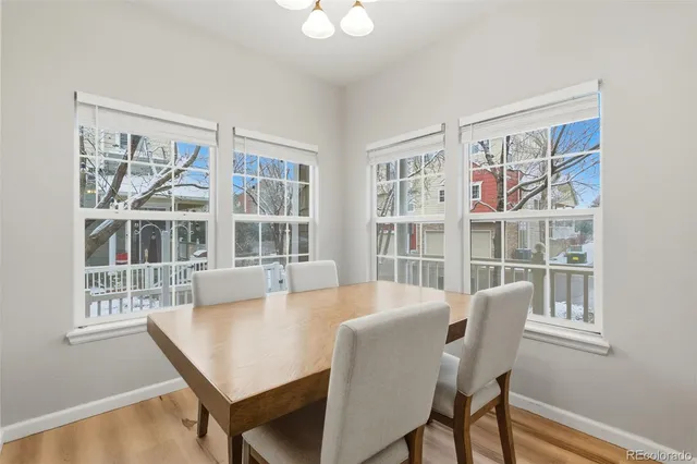 a view of a dining room with furniture and a window