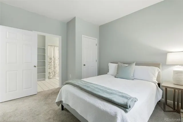 a bedroom with a bed and a night lamp