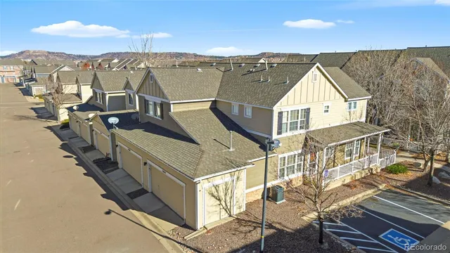 aerial view of a house with wooden fence