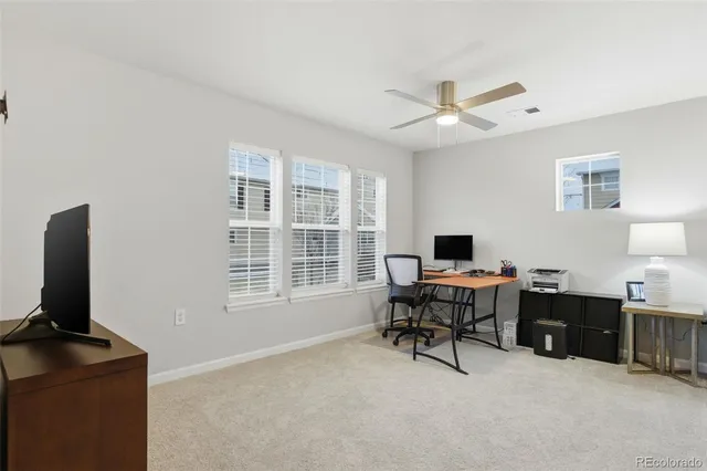 a workspace with furniture and a window
