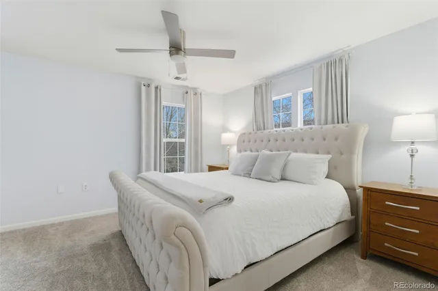 a bedroom with a bed and a lamp