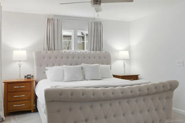 a bed room with a bed and a night stand