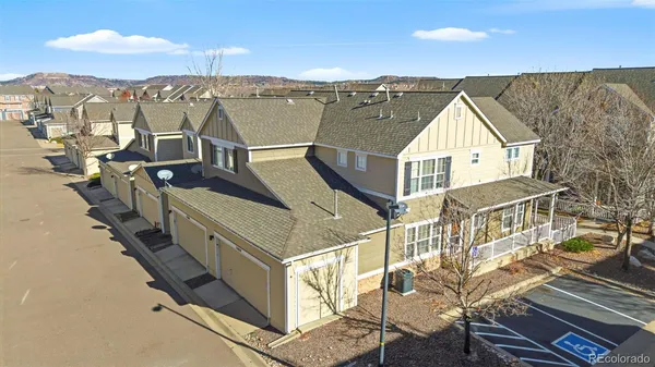 aerial view of a house with wooden fence
