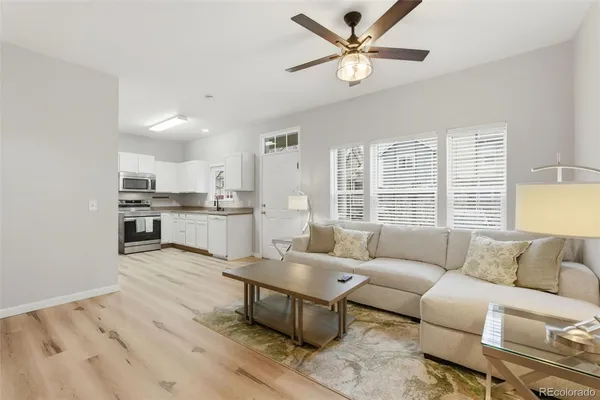 a living room with furniture and a large window