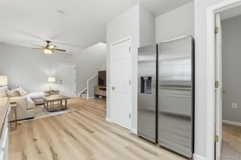 a kitchen with stainless steel appliances granite countertop a sink a stove and cabinets