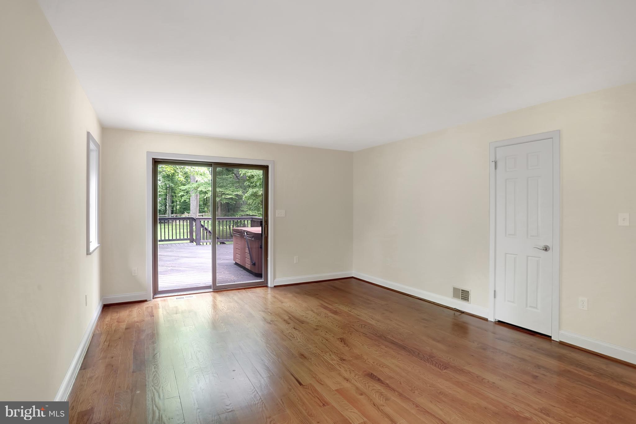 252 Cape St John Road Annapolis, MD 21401 - Photo 13 of 30 Master bedroom with walk-in closet and gleaming HW