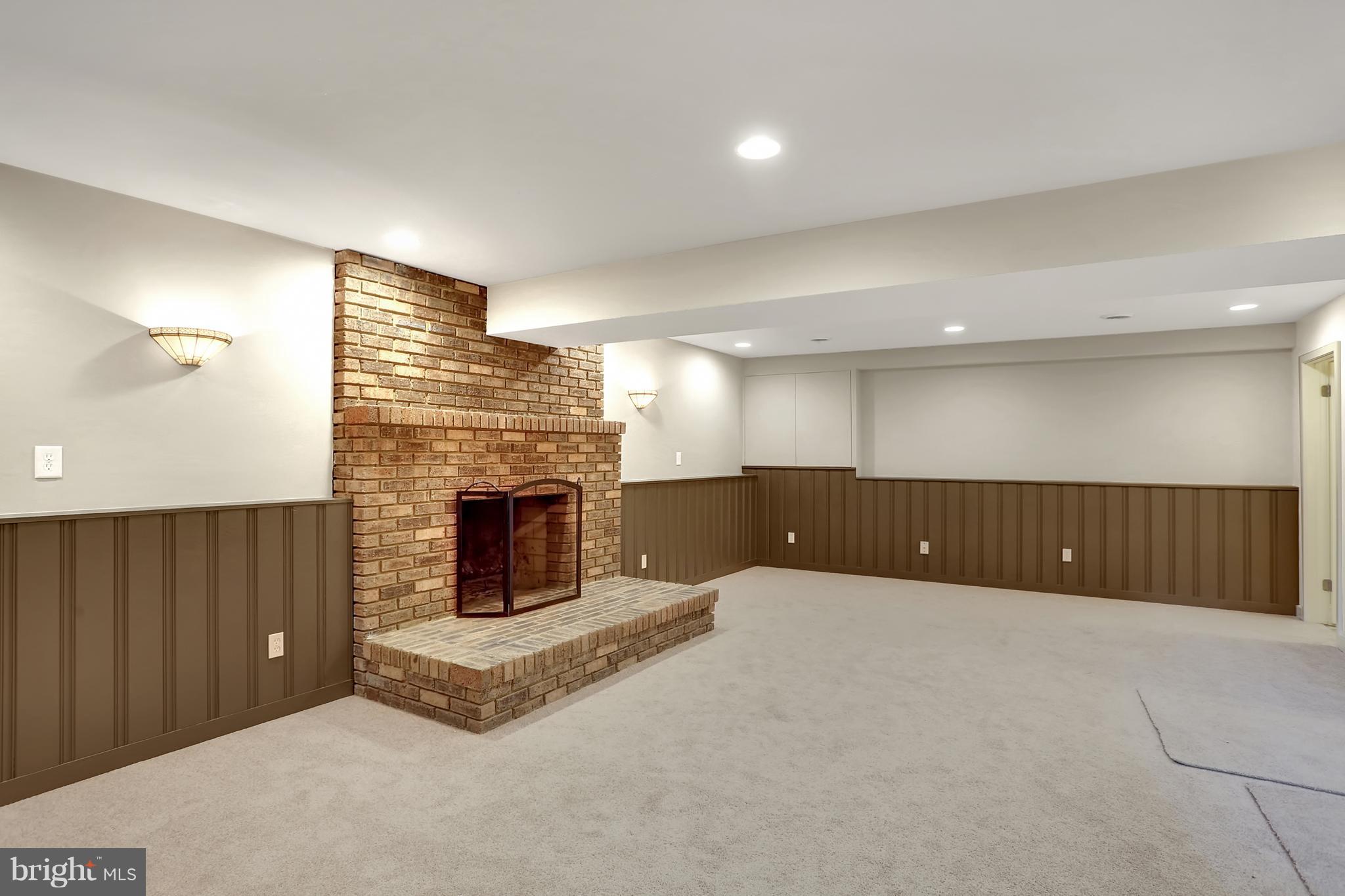252 Cape St John Road Annapolis, MD 21401 - Photo 22 of 30 Lower level family room offers a wood-burning FP