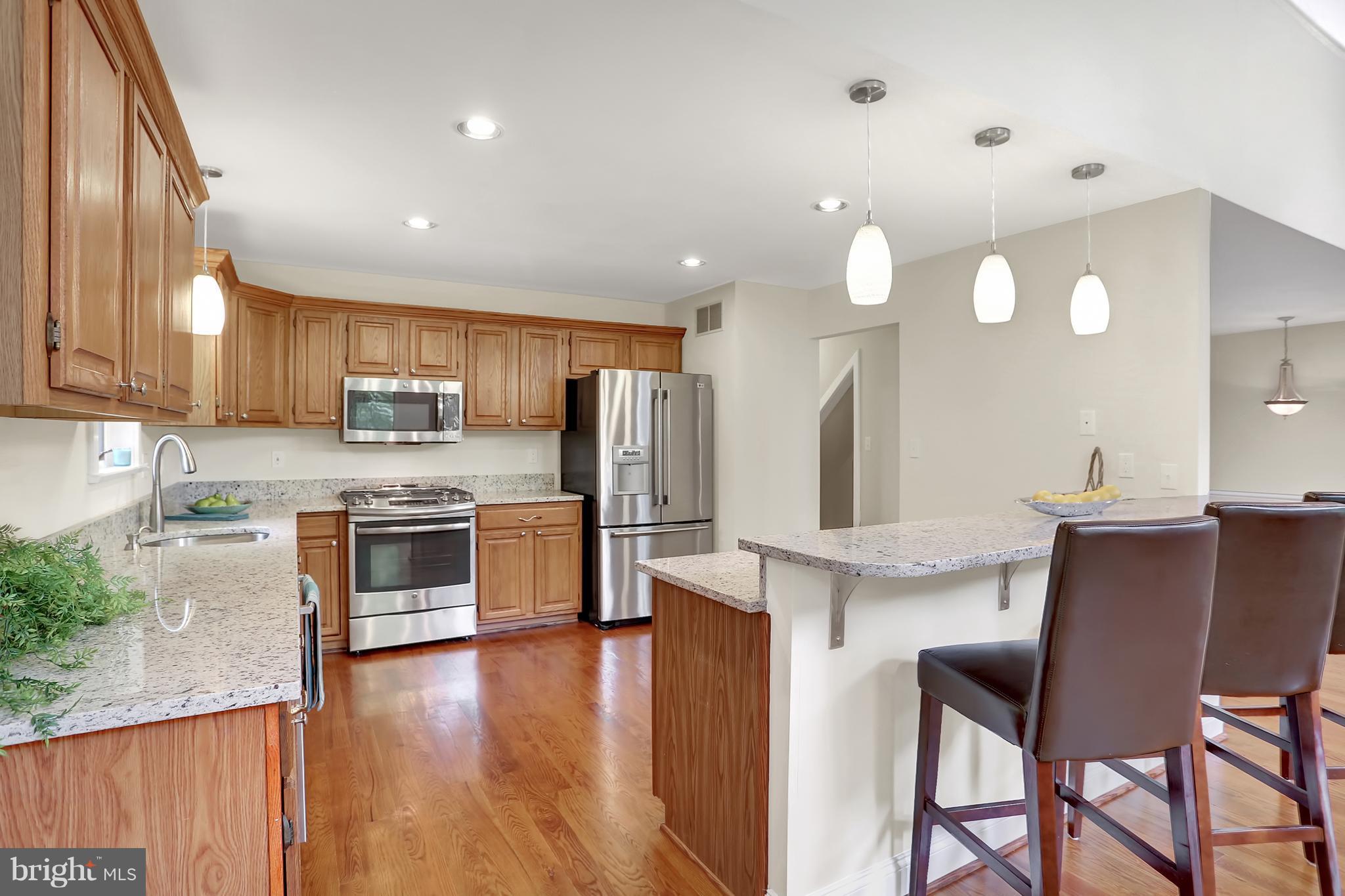 252 Cape St John Road Annapolis, MD 21401 - Photo 7 of 30 Large breakfast bar w/seating and pendant lighting