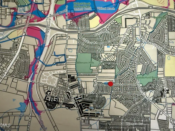 an aerial view of a swimming pool with an outdoor seating