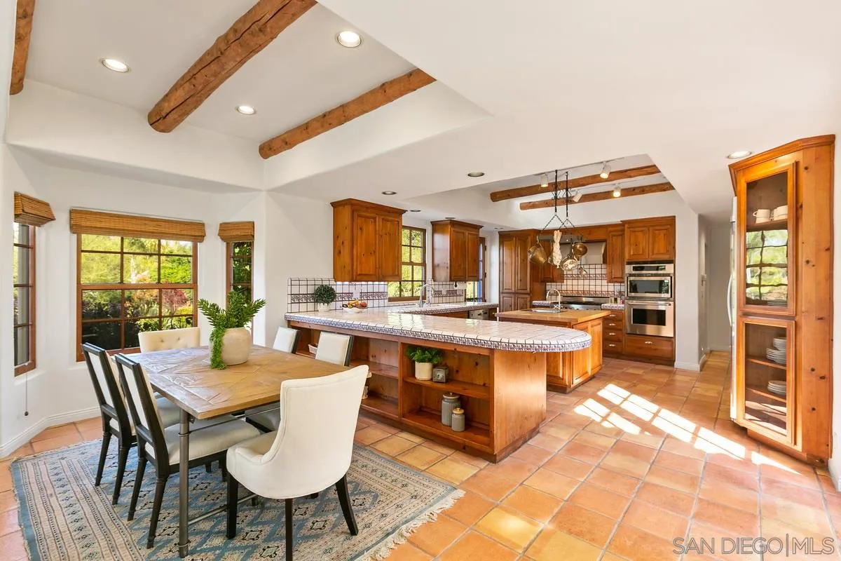 16309 Orchard Bend Road Poway, CA 92064 - Photo 12 of 66 a large kitchen with a table and chairs