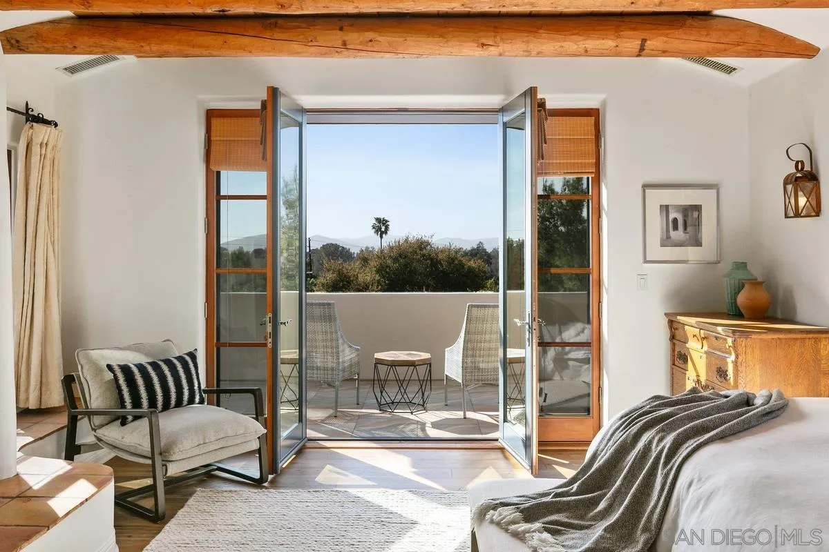 16309 Orchard Bend Road Poway, CA 92064 - Photo 25 of 66 a view of a bedroom with a bed and glass door