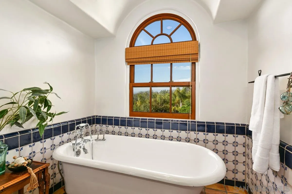 16309 Orchard Bend Road Poway, CA 92064 - Photo 28 of 66 a bath tub sitting next to a window