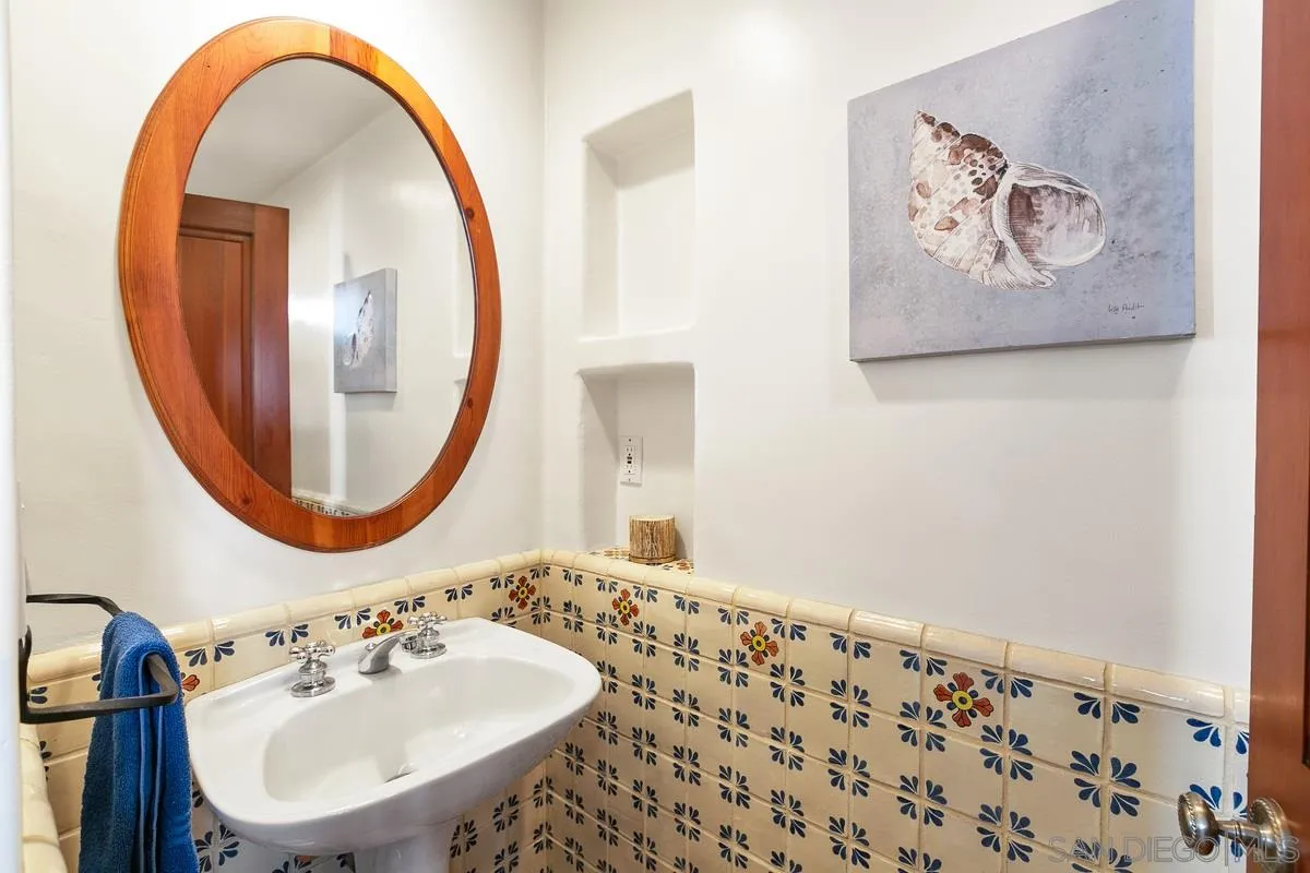 16309 Orchard Bend Road Poway, CA 92064 - Photo 34 of 66 a bathroom with a sink and a mirror