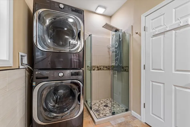 a close view of utility and utility room with washer and dryer