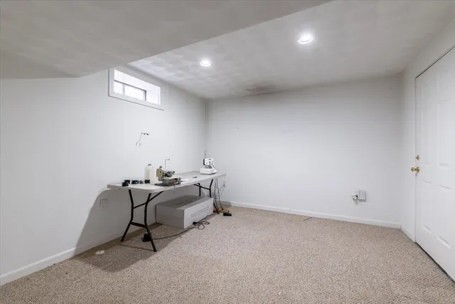 a room with gym equipment and windows