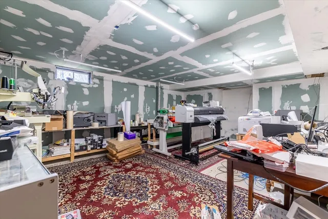 a room with lots of furniture and clutter