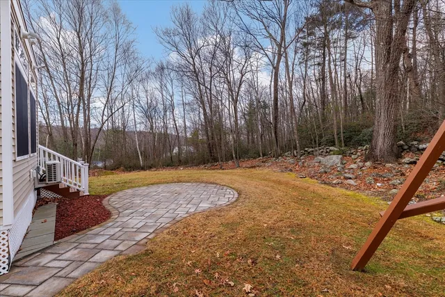 a house view with a backyard space