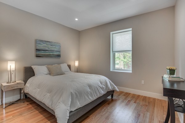 66 Perry Street, Unit 2 Brookline, MA 02446 - Photo 12 of 15 a bedroom with a bed and a window