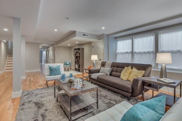 66 Perry Street, Unit 2 Brookline, MA 02446 - Photo 13 of 15 a living room with furniture and a lamp