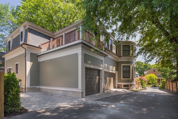 66 Perry Street, Unit 2 Brookline, MA 02446 - Photo 15 of 15 a front view of a house with a tree