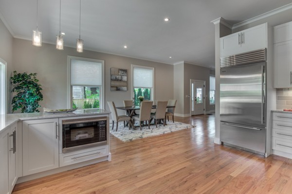 66 Perry Street, Unit 2 Brookline, MA 02446 - Photo 3 of 15 a living room with furniture and a fireplace