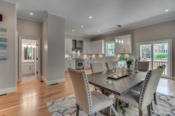 66 Perry Street, Unit 2 Brookline, MA 02446 - Photo 4 of 15 a view of a dining room with furniture window and wooden floor