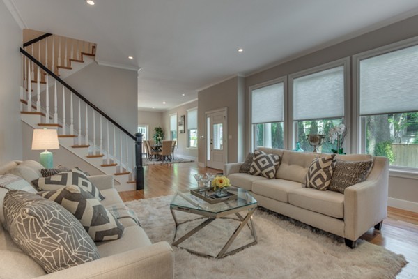 66 Perry Street, Unit 2 Brookline, MA 02446 - Photo 5 of 15 a living room with furniture and a large window
