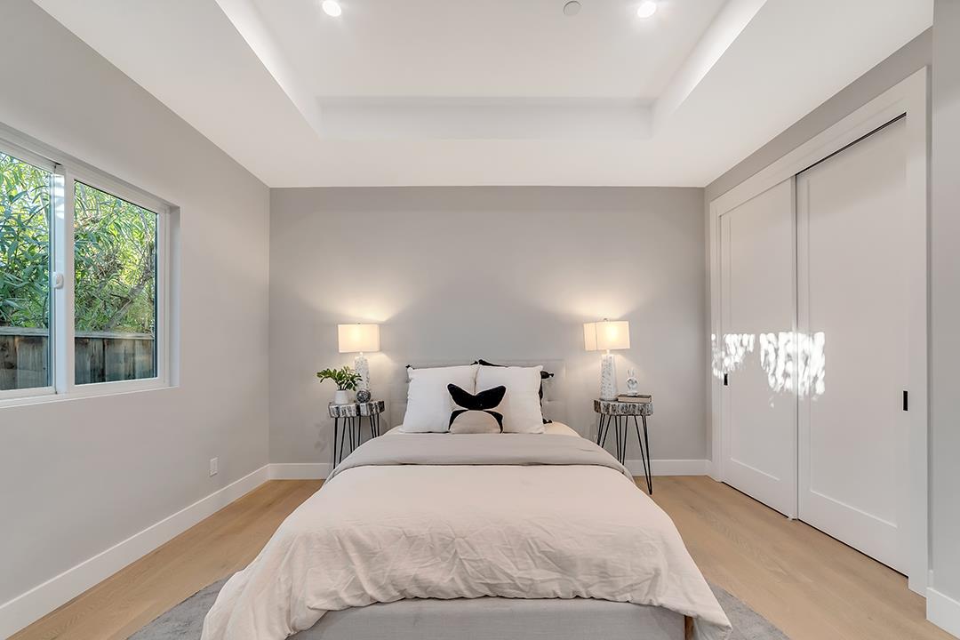 10872 West Estates Drive Cupertino, CA 95014 - Photo 18 of 58 a bedroom with a bed and wooden floor